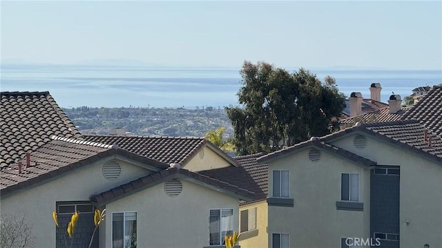38 Toulon, Laguna Niguel, CA 92677 - view of side of property with stucco siding and a tile roof
