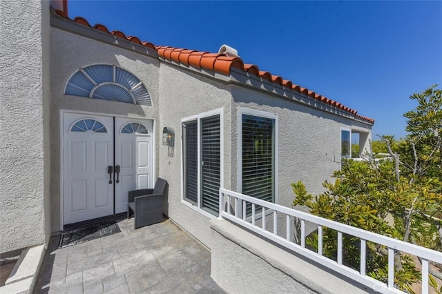 38 Toulon, Laguna Niguel, CA 92677 - property entrance with stucco siding and a tiled roof
