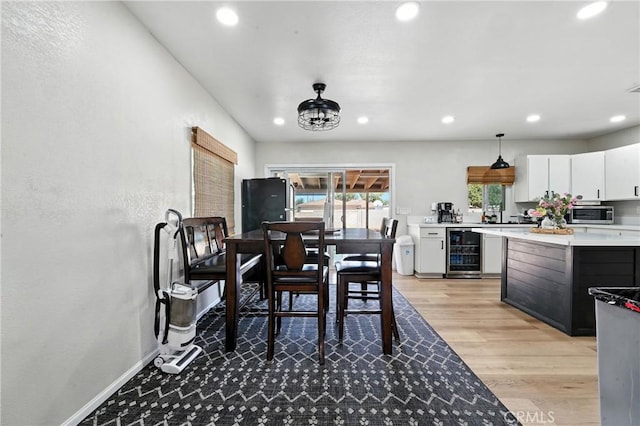 9562 Locust Ave, Fontana, CA 92335 - dining room featuring beverage cooler, recessed lighting, and light wood-type flooring