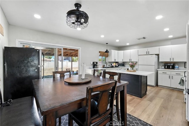 9562 Locust Ave, Fontana, CA 92335 - dining area with light wood-style floors and recessed lighting