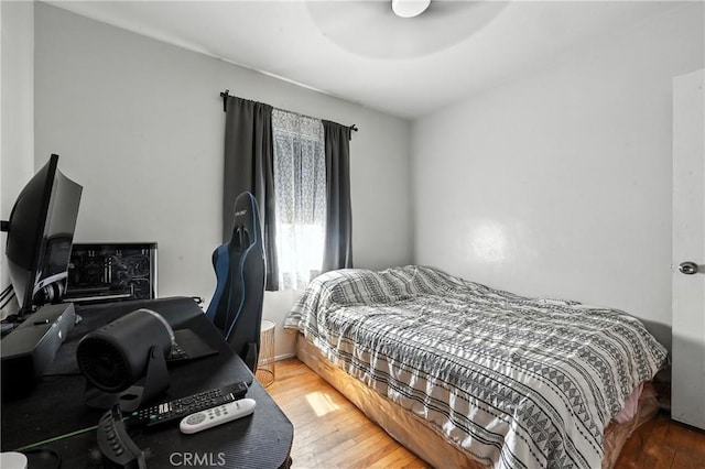 9562 Locust Ave, Fontana, CA 92335 - bedroom featuring wood-type flooring and an office area