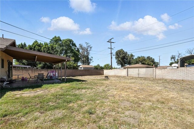 9562 Locust Ave, Fontana, CA 92335 - fenced backyard featuring a storage shed