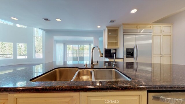 22500 N Summit Ridge Cir, Chatsworth, CA 91311 - kitchen featuring appliances with stainless steel finishes, dark stone counters, and recessed lighting