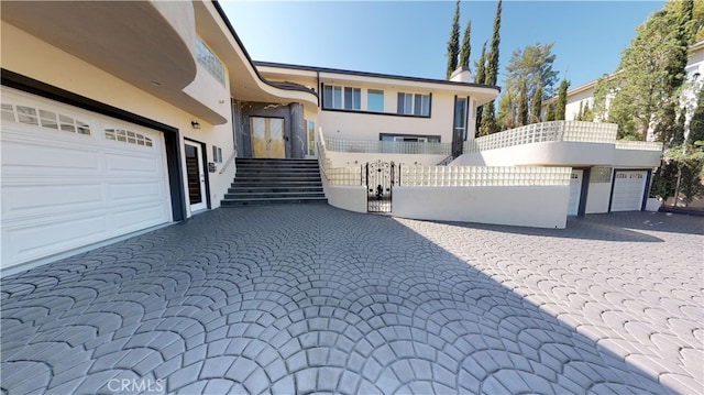 22500 N Summit Ridge Cir, Chatsworth, CA 91311 - view of front of property with stucco siding, a chimney, and a gate