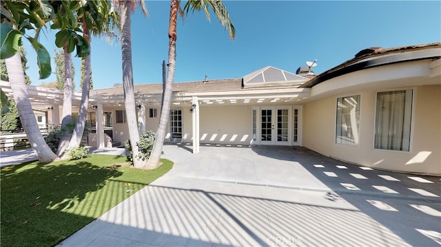 22500 N Summit Ridge Cir, Chatsworth, CA 91311 - rear view of property with french doors, stucco siding, a patio, and a yard