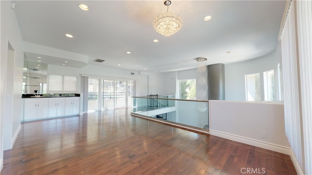 22500 N Summit Ridge Cir, Chatsworth, CA 91311 - spare room with recessed lighting, wood finished floors, and a chandelier