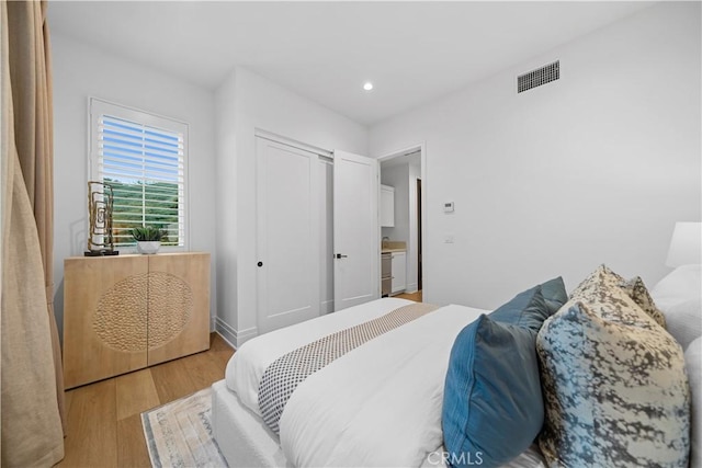 101 Lustro, Irvine, CA 92602 - bedroom featuring wood finished floors, recessed lighting, and a closet