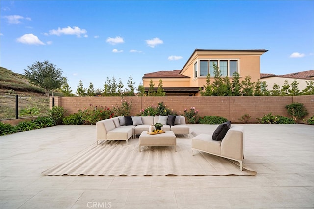 101 Lustro, Irvine, CA 92602 - fenced backyard with outdoor lounge area and a patio area