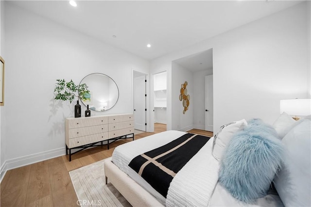 101 Lustro, Irvine, CA 92602 - bedroom with wood finished floors, recessed lighting, and a spacious closet