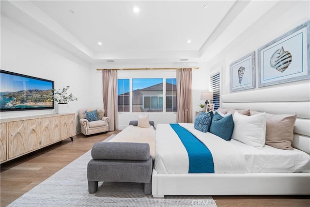 101 Lustro, Irvine, CA 92602 - bedroom featuring wood finished floors, recessed lighting, and a raised ceiling