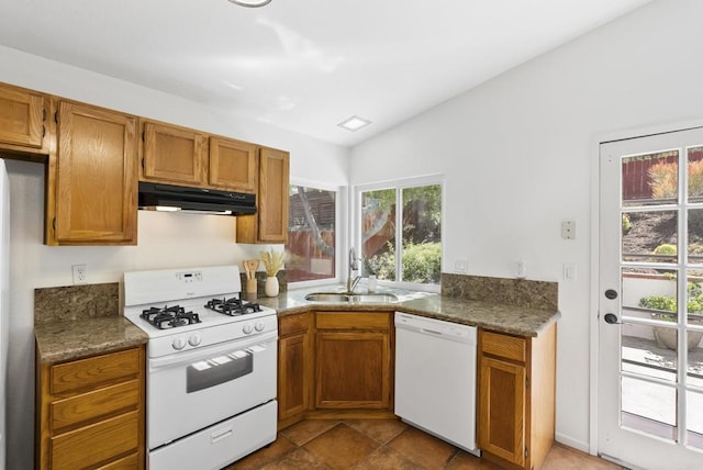 2009 Pointer Gln, Escondido, CA 92029 - kitchen featuring white appliances, under cabinet range hood, vaulted ceiling, plenty of natural light, and brown cabinets