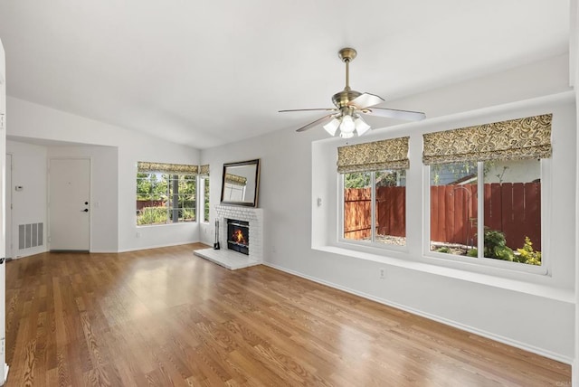 2009 Pointer Gln, Escondido, CA 92029 - unfurnished living room with a ceiling fan, a fireplace, wood finished floors, and lofted ceiling