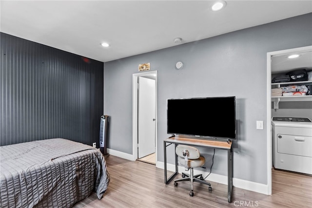 10155 De Soto Ave Unit 104, Chatsworth, CA 91311 - bedroom with washer / dryer, wood finished floors, and recessed lighting