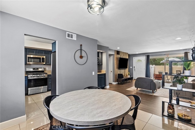 10155 De Soto Ave Unit 104, Chatsworth, CA 91311 - dining area with light tile patterned floors and baseboards