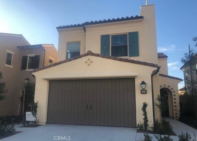 111 Omar, Irvine, CA 92620 - mediterranean / spanish house featuring stucco siding, concrete driveway, and an attached garage