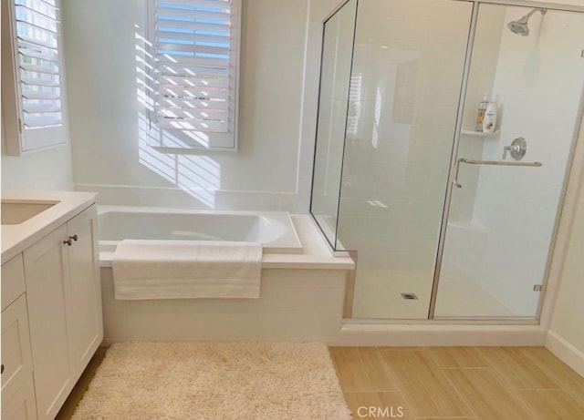 111 Omar, Irvine, CA 92620 - full bathroom with a shower stall, a garden tub, and vanity
