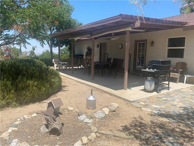 8978 Broken Spur Rd, Pinon Hills, CA 92372 - rear view of house with a patio area, stucco siding, and outdoor dining space