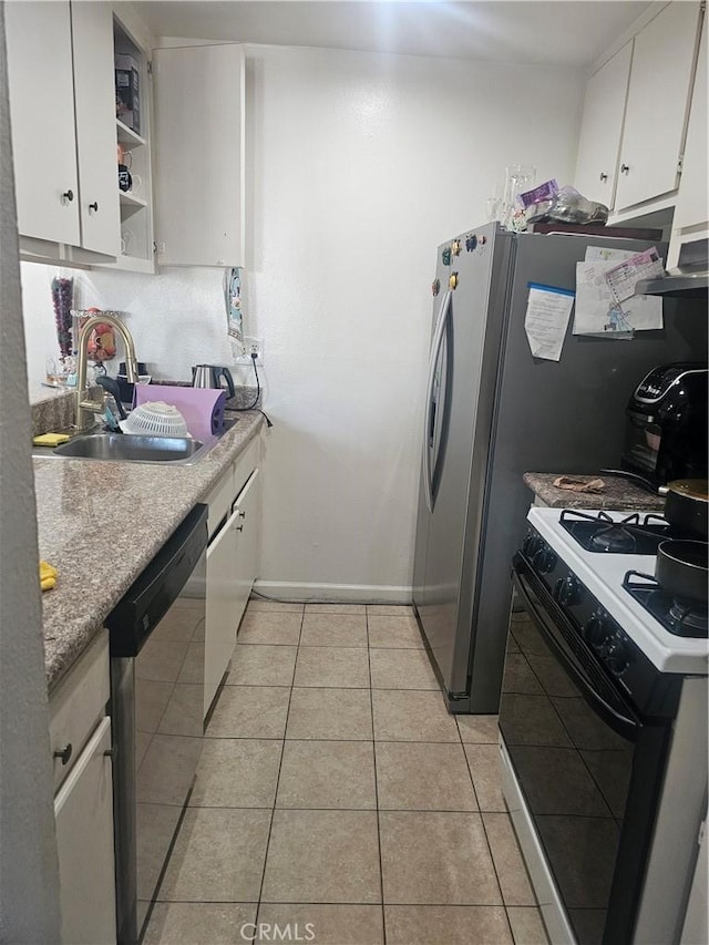 8601 International Ave Unit 266, Canoga Park, CA 91304 - kitchen featuring range with gas stovetop, dishwasher, white cabinets, light tile patterned floors, and open shelves