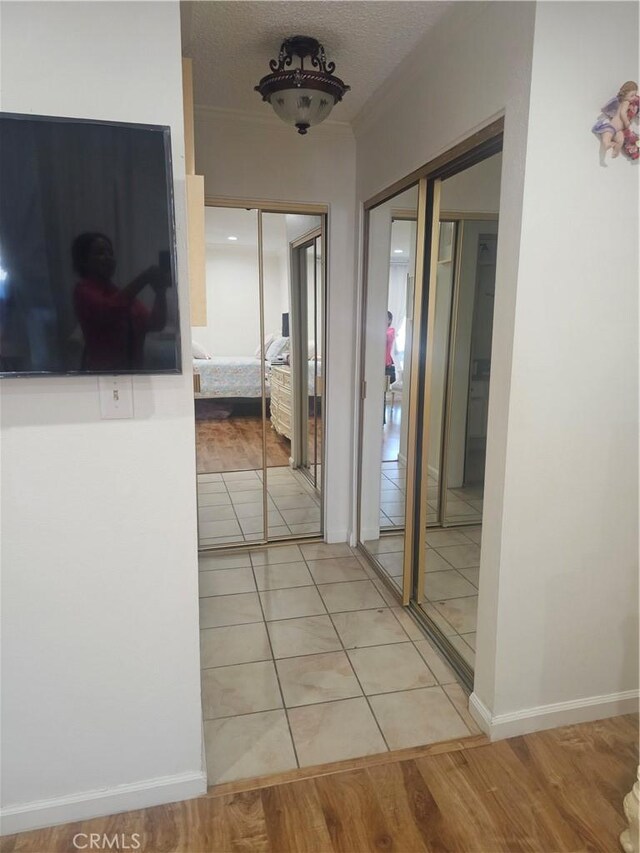 8601 International Ave Unit 266, Canoga Park, CA 91304 - hall with light tile patterned flooring and a textured ceiling