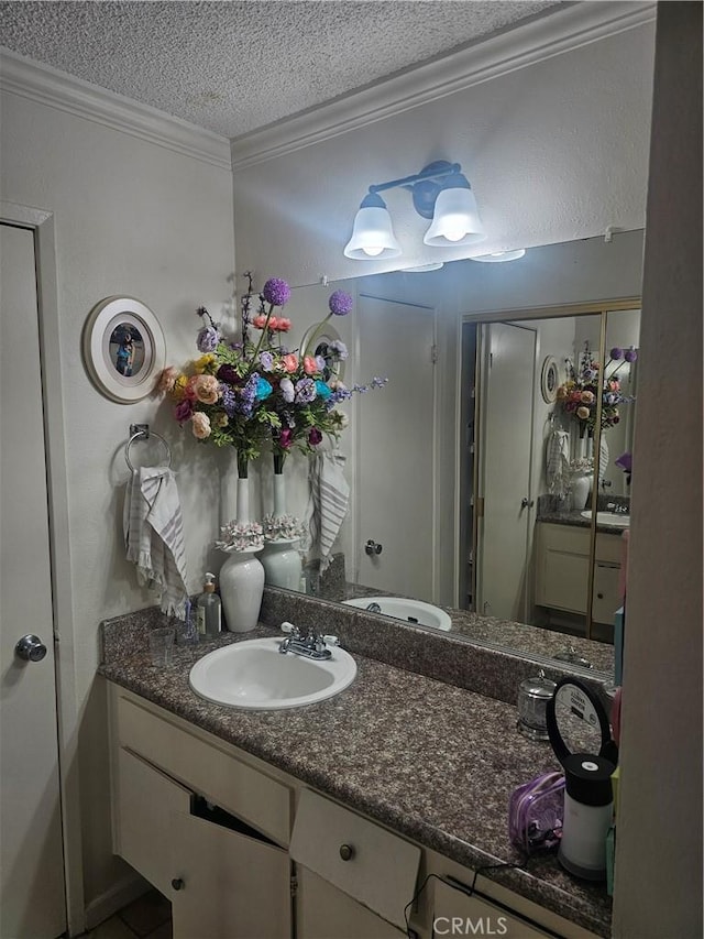 8601 International Ave Unit 266, Canoga Park, CA 91304 - bathroom with ornamental molding, a textured ceiling, vanity, and a shower stall