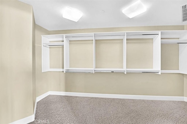 5124 Scholarship Unit 1007, Irvine, CA 92612 - walk in closet featuring carpet flooring