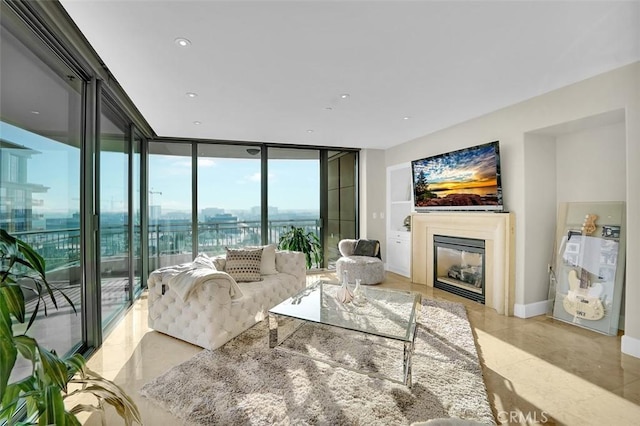 5124 Scholarship Unit 1007, Irvine, CA 92612 - living room featuring floor to ceiling windows, a glass covered fireplace, and light tile patterned floors