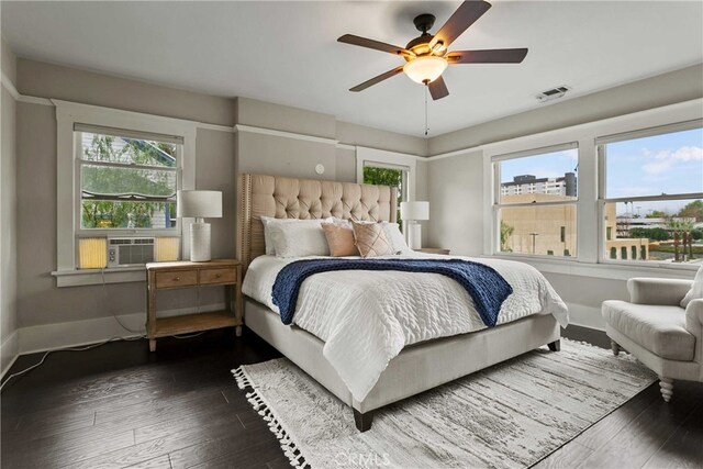 3354 Orange St, Riverside, CA 92501 - bedroom with multiple windows, dark wood-style floors, and a ceiling fan