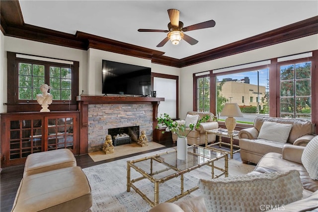 3354 Orange St, Riverside, CA 92501 - living room with ornamental molding, a stone fireplace, wood finished floors, and a ceiling fan