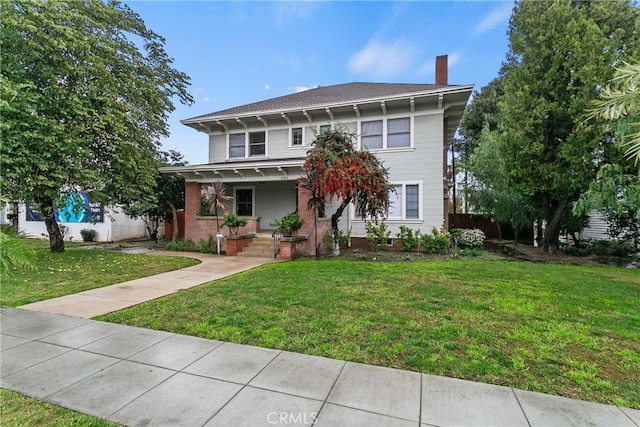3354 Orange St, Riverside, CA 92501 - american foursquare style home featuring covered porch, a chimney, and a front lawn