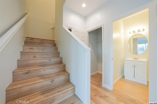 25401 Holly Beach Dr, Saugus, CA 91350 - staircase featuring wood finished floors and baseboards