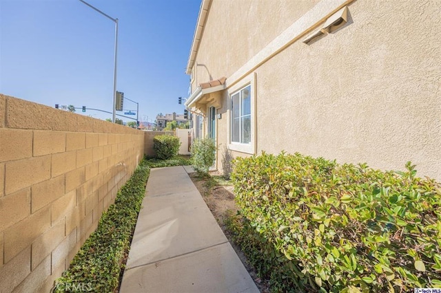 25401 Holly Beach Dr, Saugus, CA 91350 - view of home's exterior featuring a fenced backyard and stucco siding