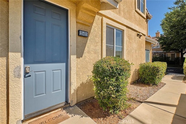 25401 Holly Beach Dr, Saugus, CA 91350 - view of exterior entry with stucco siding