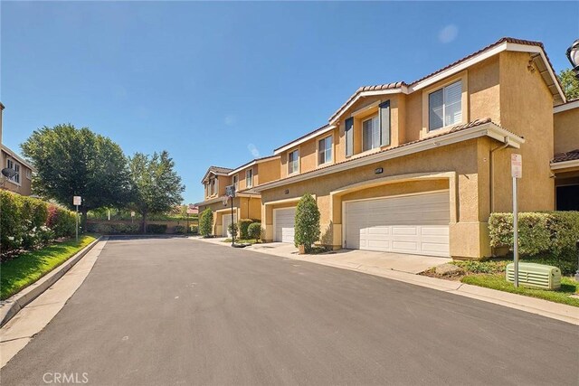 25401 Holly Beach Dr, Saugus, CA 91350 - view of asphalt street with street lighting and curbs