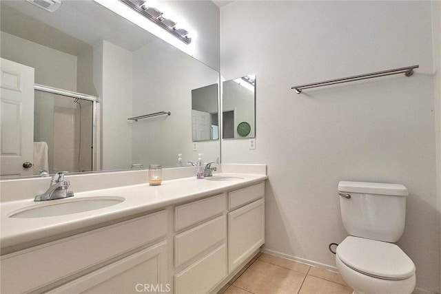 25401 Holly Beach Dr, Saugus, CA 91350 - bathroom with tile patterned floors, double vanity, and a shower with door