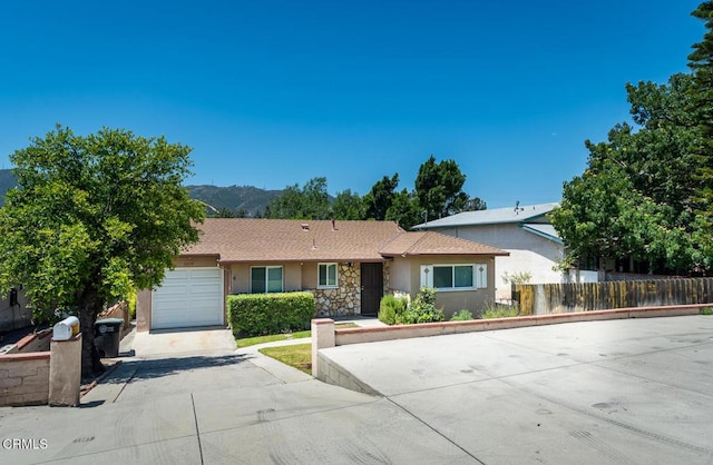 3910 Vista Ct, La Crescenta, CA 91214 - ranch-style home featuring stucco siding, driveway, an attached garage, and a mountain view