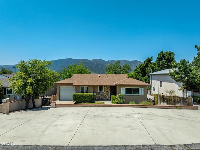 3910 Vista Ct, La Crescenta, CA 91214 - ranch-style home with stucco siding, a mountain view, and a garage