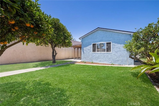 1410 Gulf Ave, Wilmington, CA 90744 - back of house featuring stucco siding and a lawn