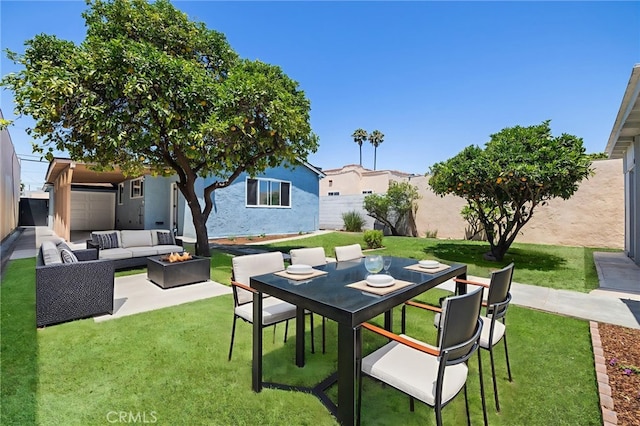 1410 Gulf Ave, Wilmington, CA 90744 - fenced backyard with an outdoor living space with a fire pit and a patio area