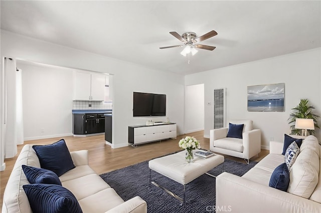 1410 Gulf Ave, Wilmington, CA 90744 - living area with a ceiling fan, light wood finished floors, and a heating unit
