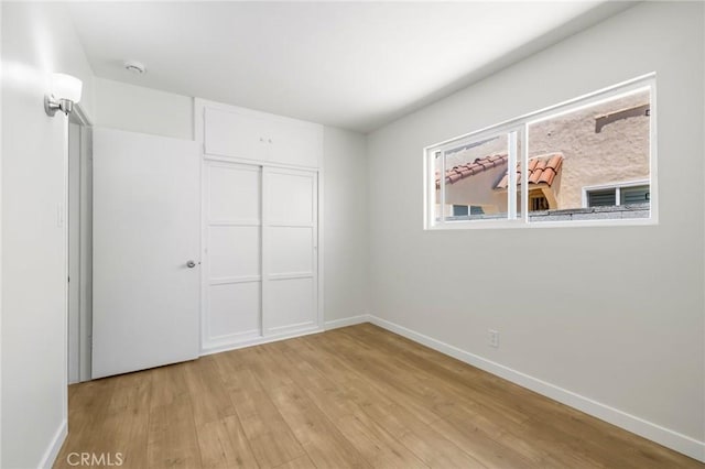 1410 Gulf Ave, Wilmington, CA 90744 - unfurnished bedroom featuring light wood-style floors and a closet