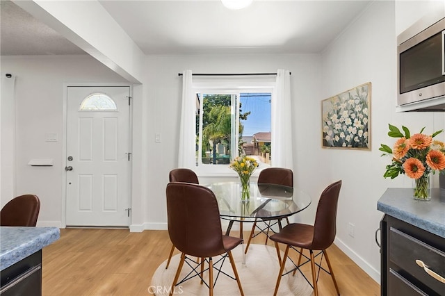 1410 Gulf Ave, Wilmington, CA 90744 - dining space with light wood-style floors and healthy amount of natural light