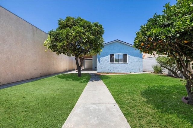 1410 Gulf Ave, Wilmington, CA 90744 - view of front of property with stucco siding and a fenced backyard