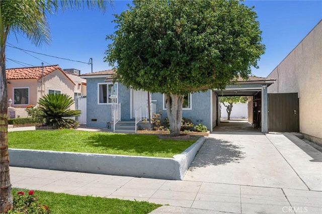 1410 Gulf Ave, Wilmington, CA 90744 - view of front facade featuring stucco siding, a front lawn, and driveway