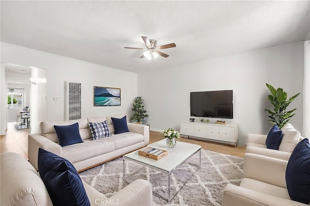 1410 Gulf Ave, Wilmington, CA 90744 - living room with a ceiling fan, a heating unit, and wood finished floors