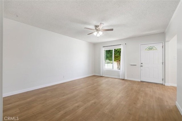 1410 Gulf Ave, Wilmington, CA 90744 - unfurnished room with ceiling fan, wood finished floors, and a textured ceiling