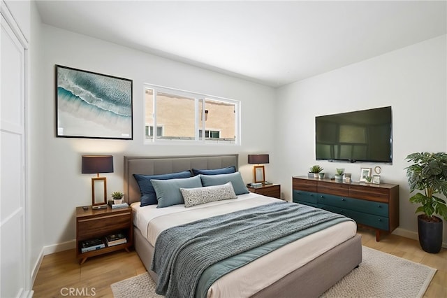 1410 Gulf Ave, Wilmington, CA 90744 - bedroom with light wood-type flooring and baseboards
