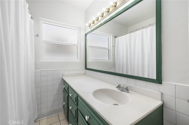 1410 Gulf Ave, Wilmington, CA 90744 - full bathroom with tile walls, vanity, tile patterned flooring, wainscoting, and a shower with curtain