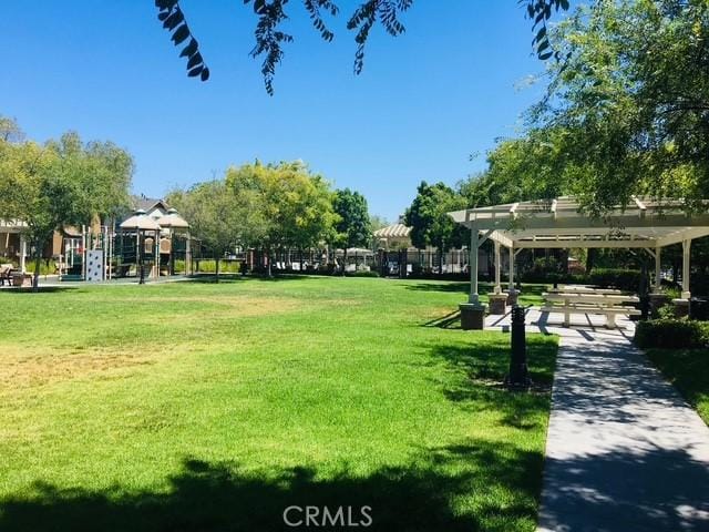 284 Tustin Field Dr, Tustin, CA 92782 - view of home's community with a lawn and a pergola