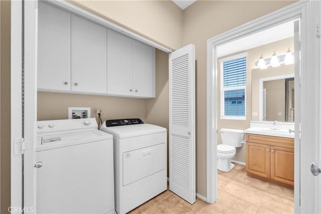 284 Tustin Field Dr, Tustin, CA 92782 - washroom with cabinet space, separate washer and dryer, and light tile patterned floors