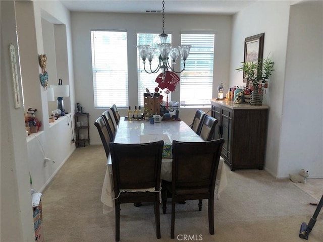 20800 Indigo, Riverside, CA 92508 - dining area with light carpet, a chandelier, and healthy amount of natural light